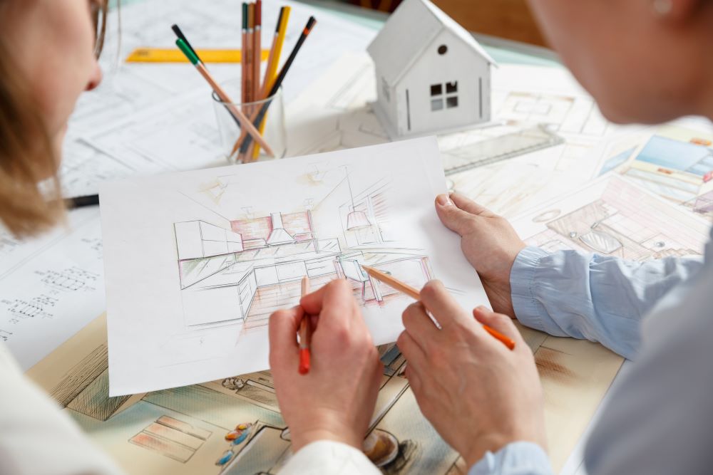 Two people doing a kitchen layout before renovation