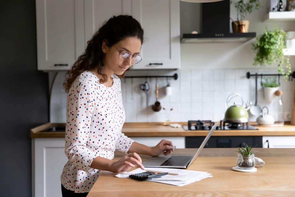 Woman establishing kitchen renovation budget