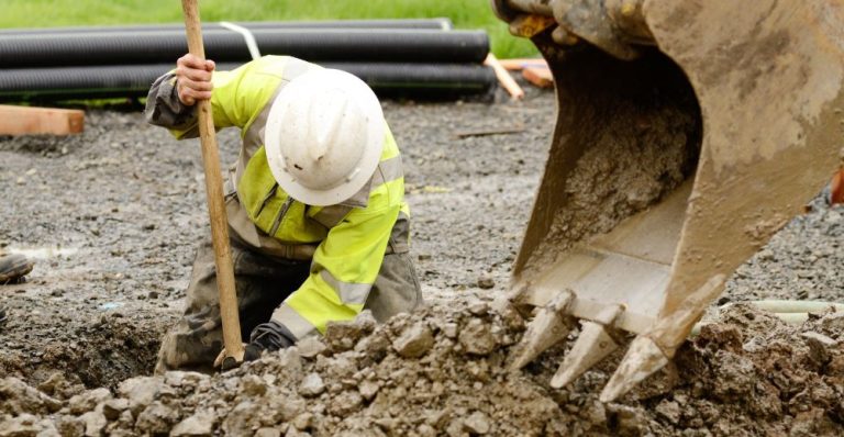 Expert worker on an excavation site